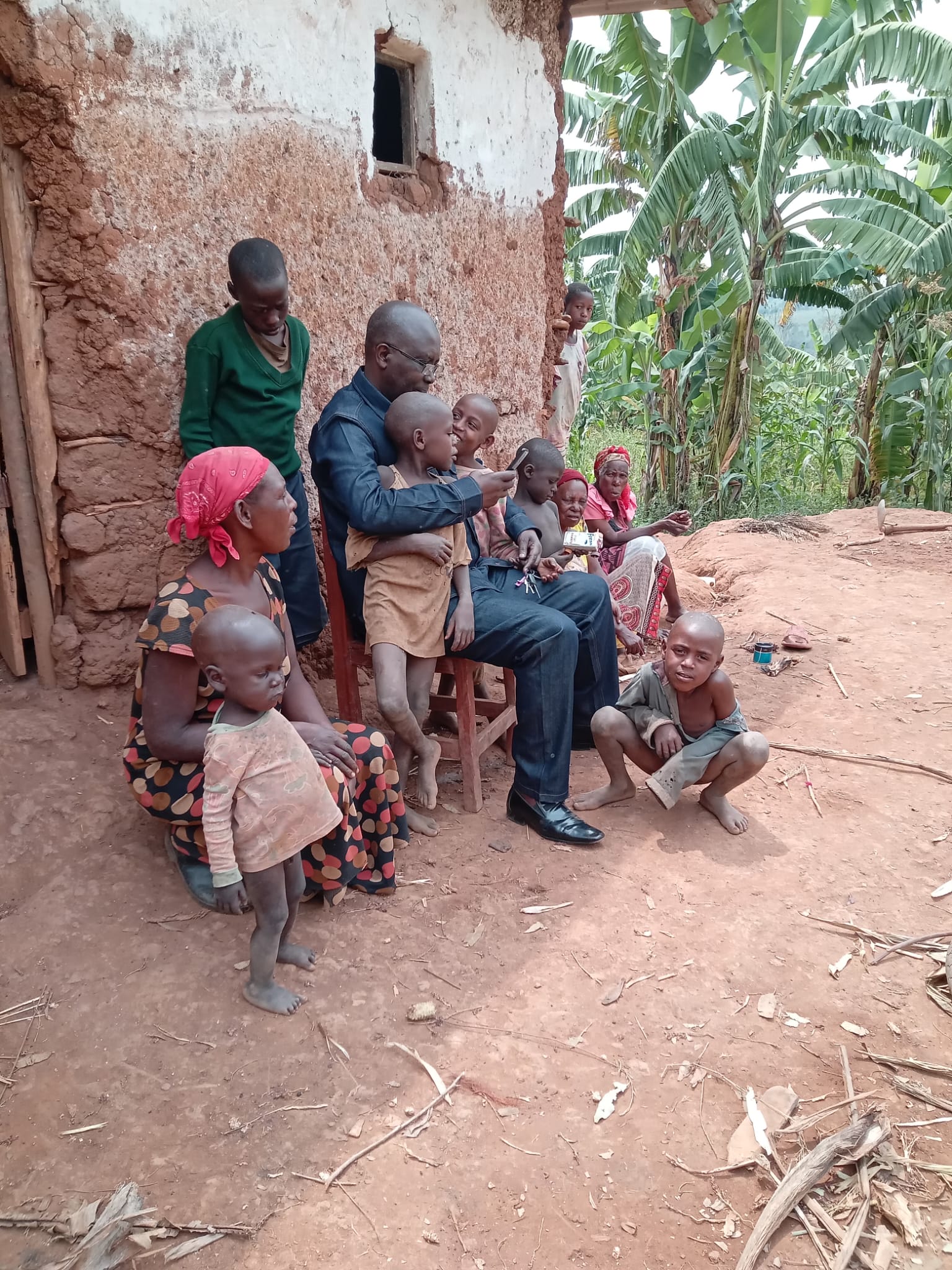 APF's founder and team visiting the widow's family at their home