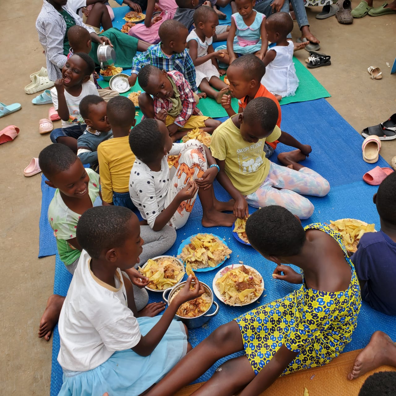 Children sharing a meal at an APF feeding event