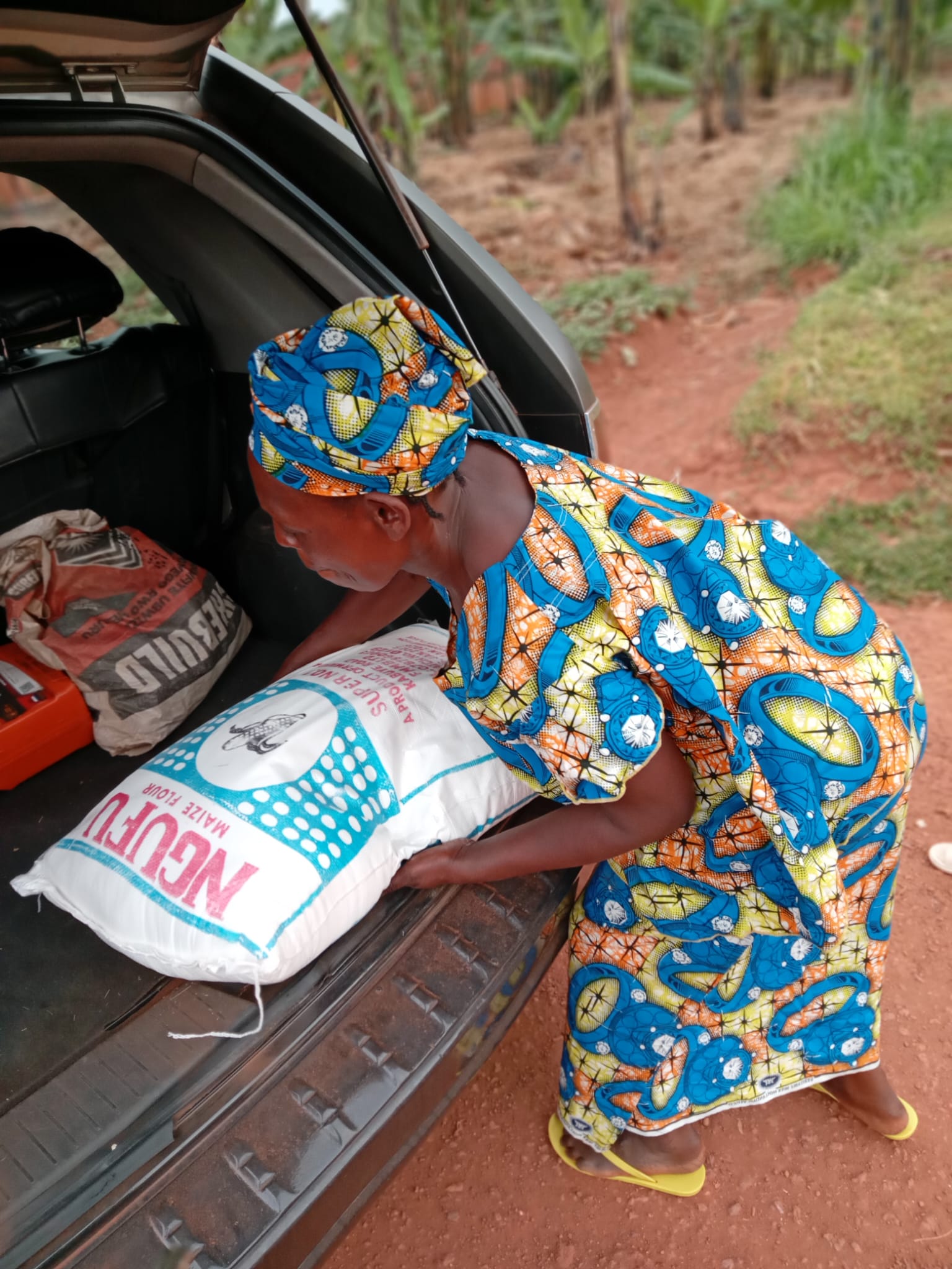 APF delivering maize flour and food supplies to a family
