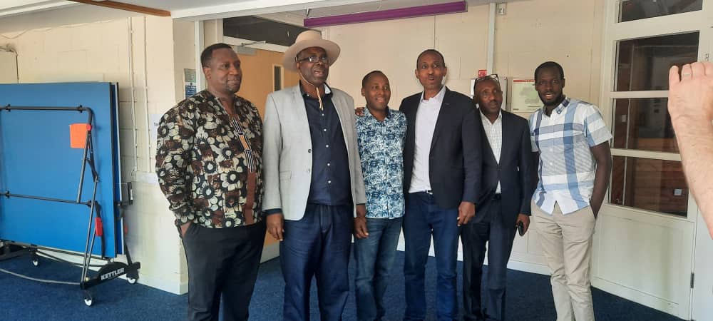 APF's reconciliation team and trustees with the founder in the UK